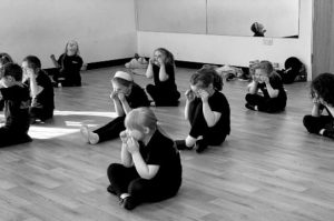 PA juniors seated in rows acting