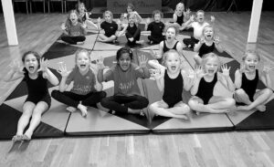 Acro on red and black mat